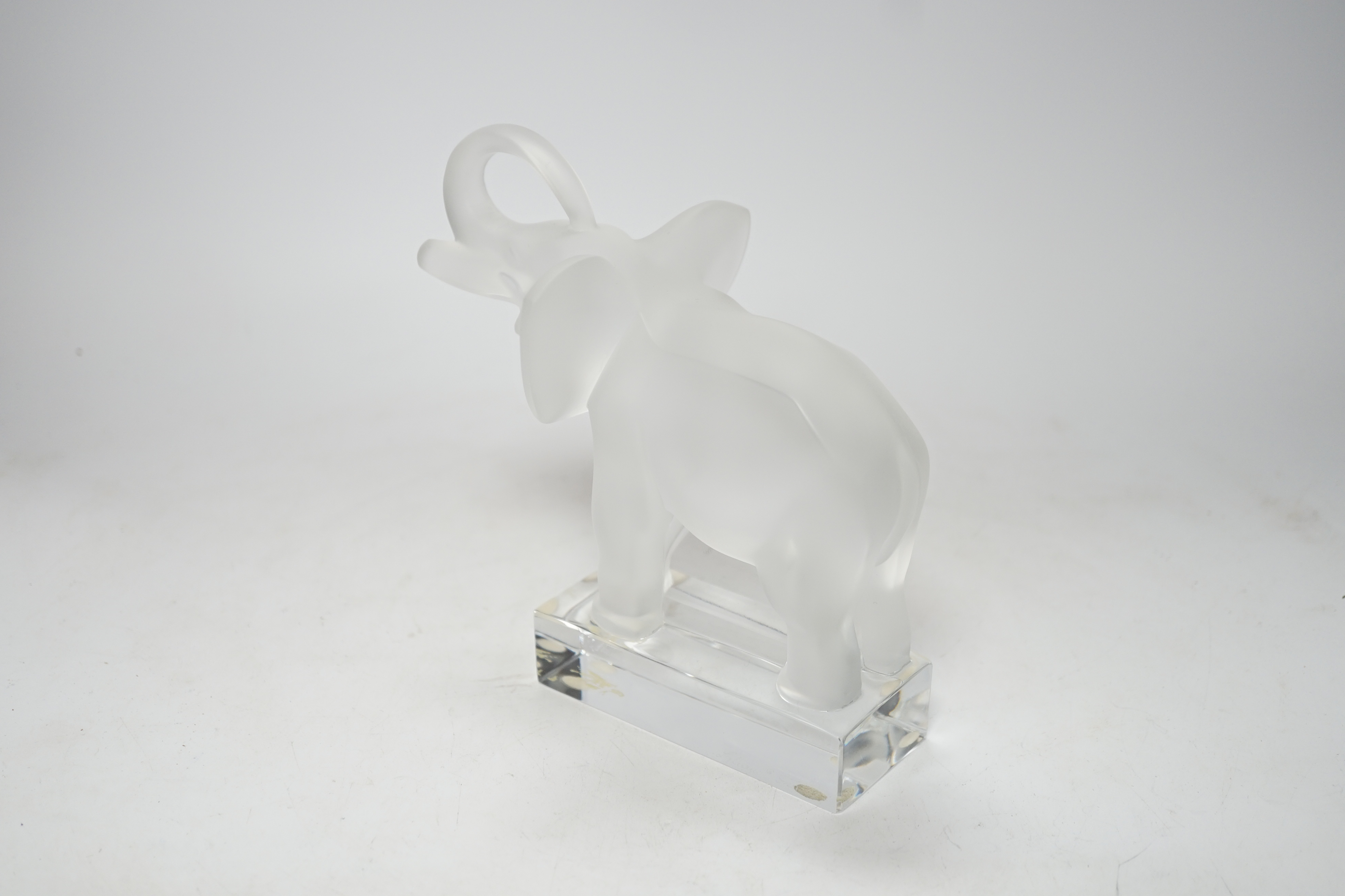 A Lalique frosted glass model of an elephant, signed to the base, 16cm high